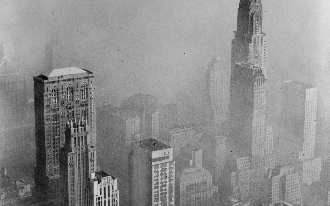 Christyler building skyscraper reaching high out of the smog in the city